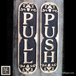 PUSH /PULL ornate bronze door signs.