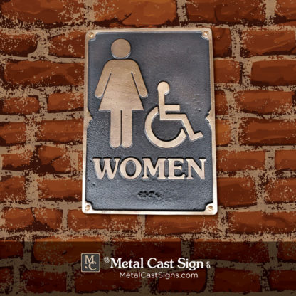 Women ADA Braille restroom sign cast bronze brick
