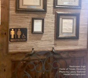 Bronze restroom symbol sign for restaurant