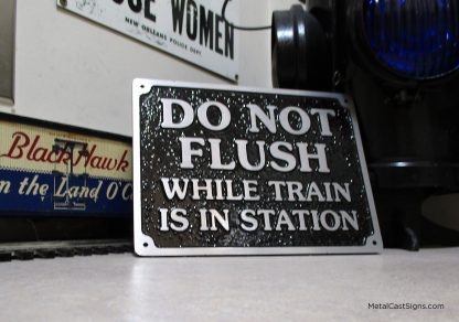 Do Not Flush While Train is in Station - cast aluminum sign. train sign