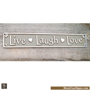 Live Laugh Love plaque with hearts. Aluminum sign - tan background. 10 inches long.