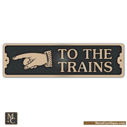 To The Trains bronze sign w/ left pointing hand