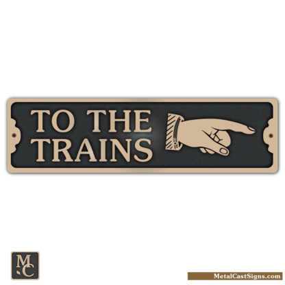 To The Trains bronze sign w/right pointing hand